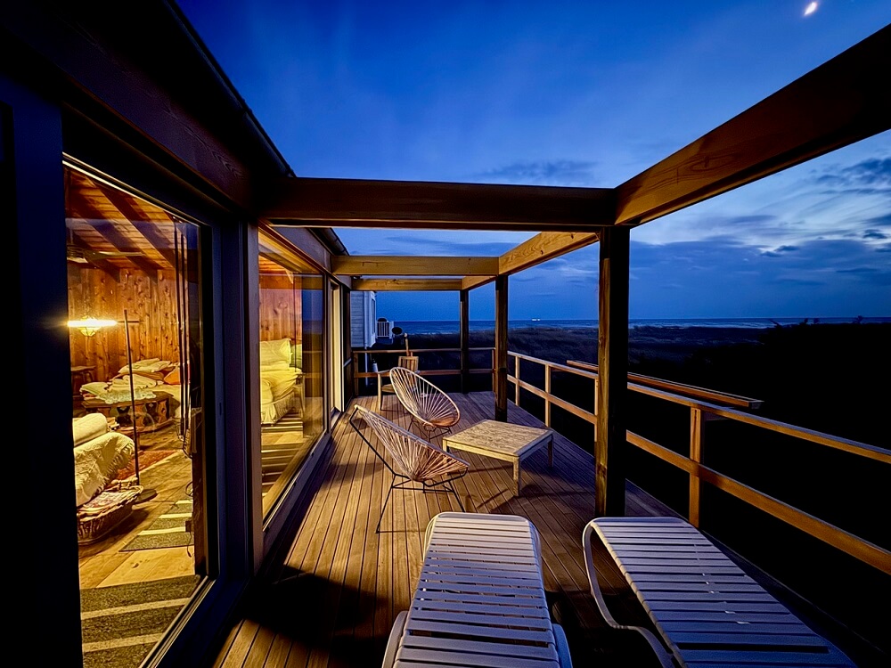 patio of long island beach house with white European aluminum windows