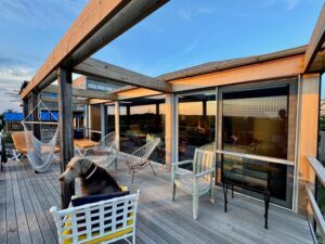 terrace of long island beach house with white European aluminum windows