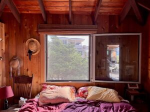 bedroom in long island beach house with white European aluminum tilt turn windows