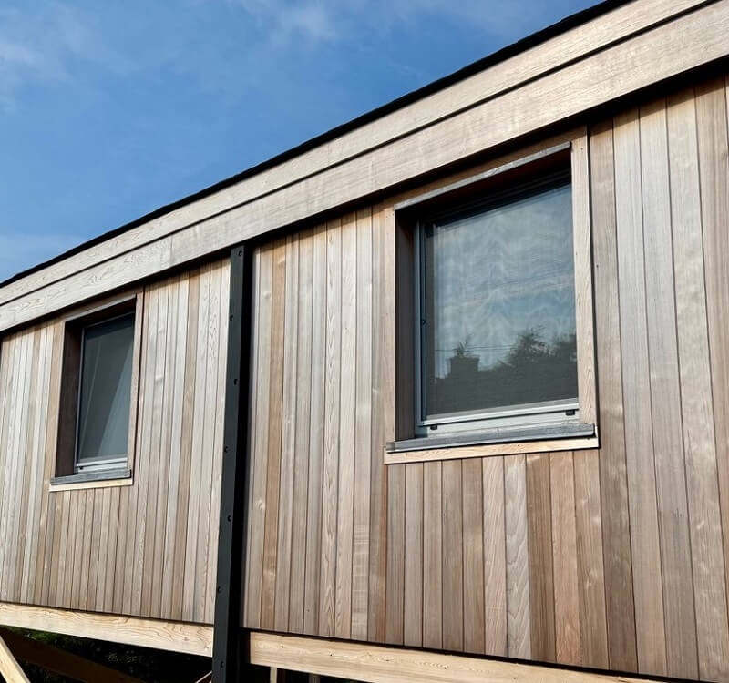 exterior wall long island beach house with white European aluminum tilt turn windows
