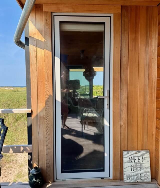long island beach house with white European aluminum glass doors