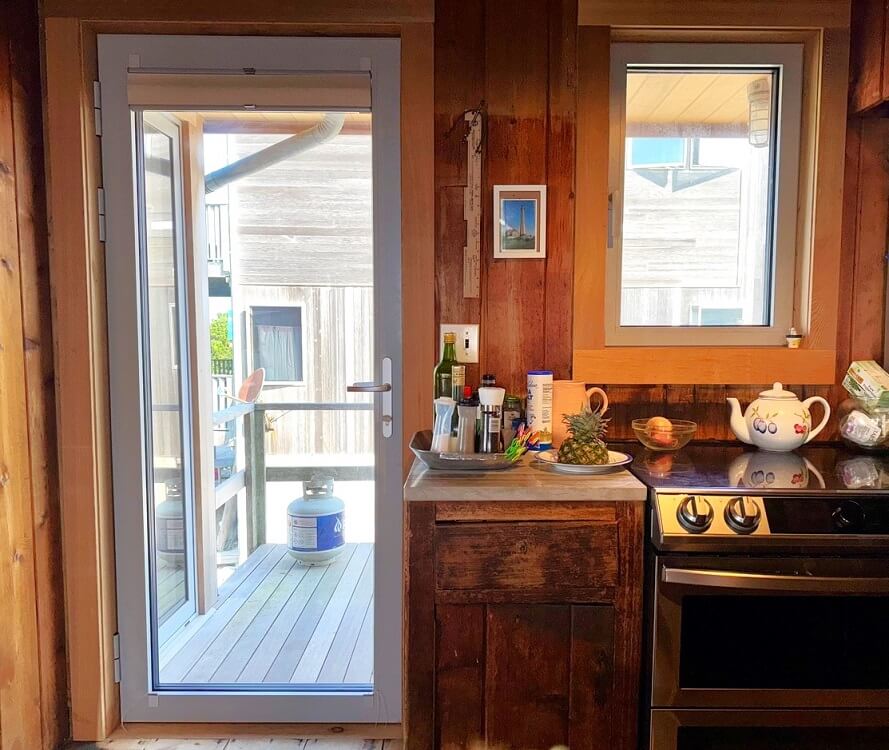 long island beach house with white European aluminum glass doors inside view