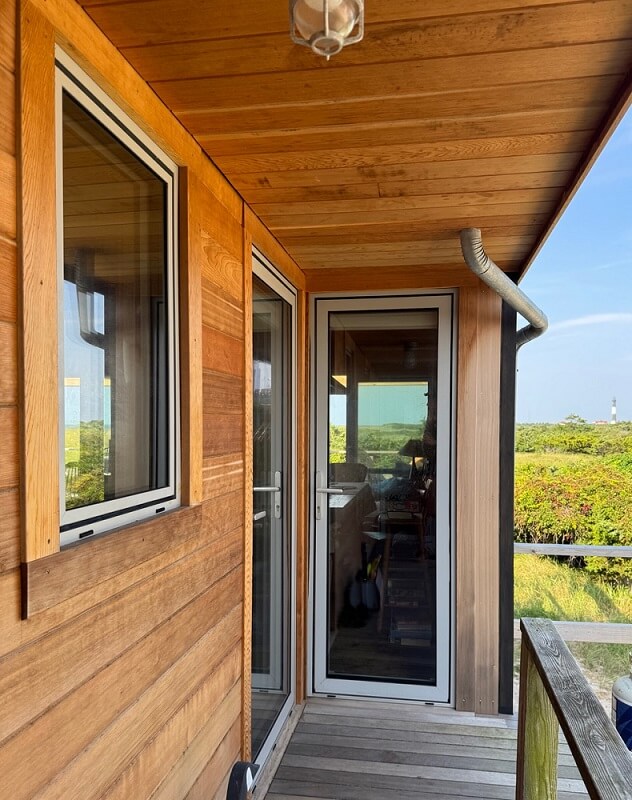 long island beach house with white European aluminum windows and entry doors