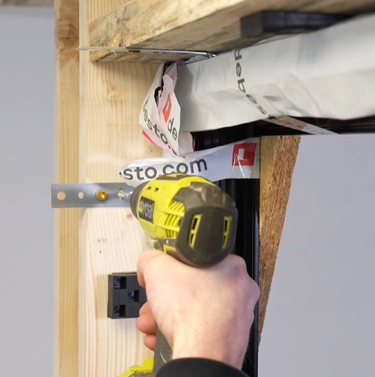 installing window to the opening with anchors